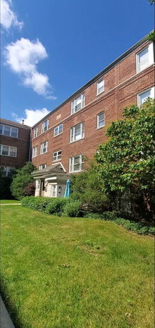 Front view of a multi-story brick building.