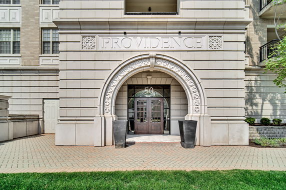 Front view of a large building entrance with architectural details.