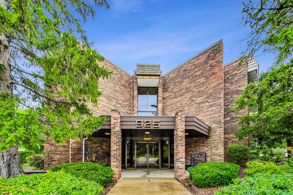 Front view of a brick building with a modern architectural style.