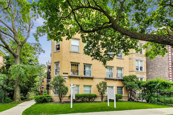 Front view of a multi-story brick building.