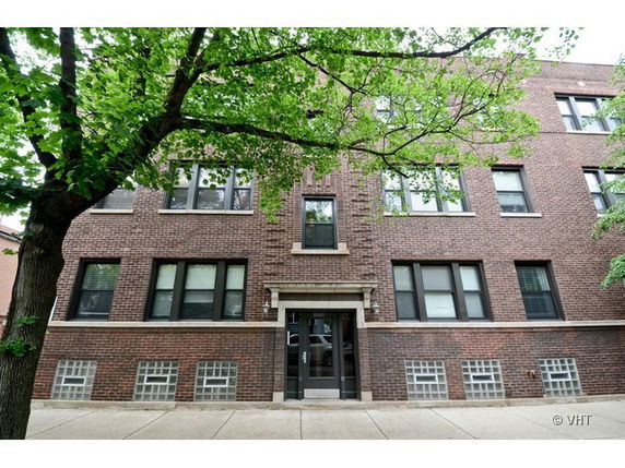 Front view of a multi-story brick building.