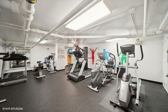 Indoor gym area with exercise equipment.