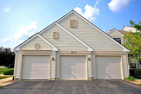 Front view of a house with a three-car garage.