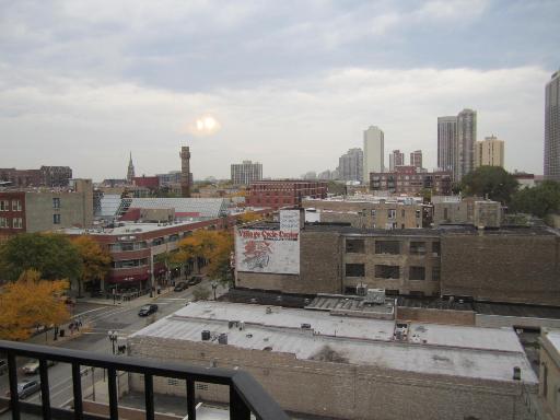 Panoramic view of city buildings from a high vantage point.