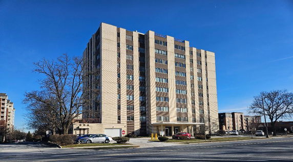 Front view of a multi-story building with a modern design.