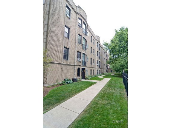 Front view of a multi-story brick apartment building
