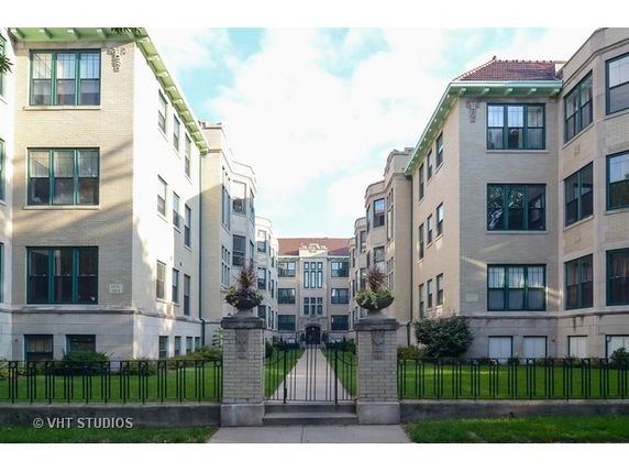 Front view of an apartment building complex with multiple stories.