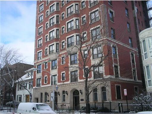 Front elevation of a multi-story brick apartment building