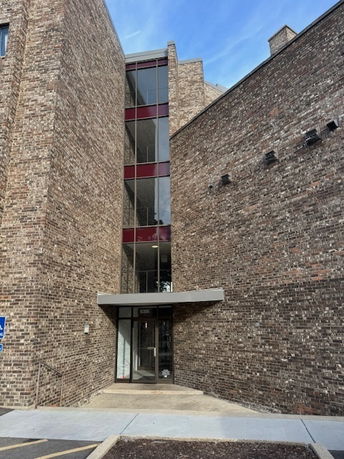 Front view of a brick commercial building.
