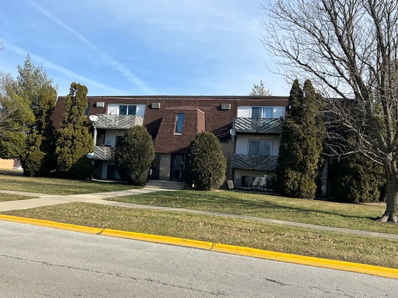 Front view of a multi-story apartment building.