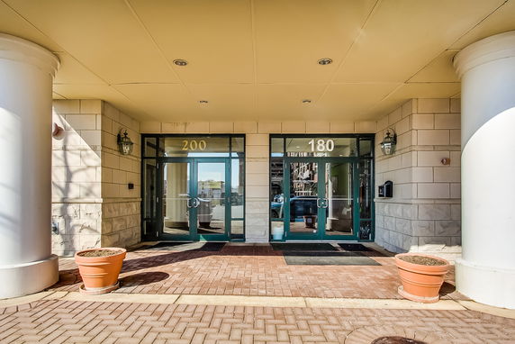 Front view of a building entrance with two glass doors numbered 200 and 180.