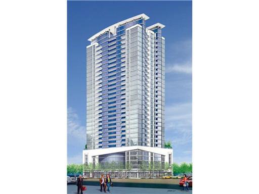 Front view of a tall, modern high-rise building with extensive glass facade.