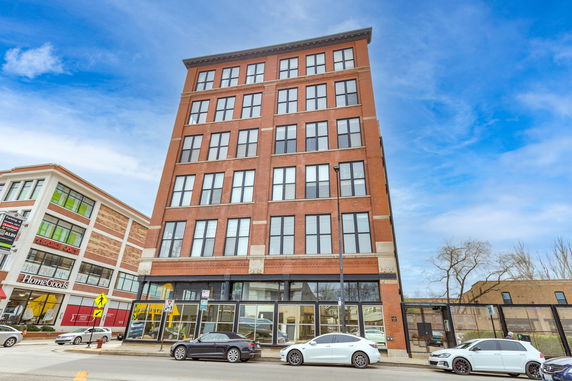Front view of a multi-story brick building.