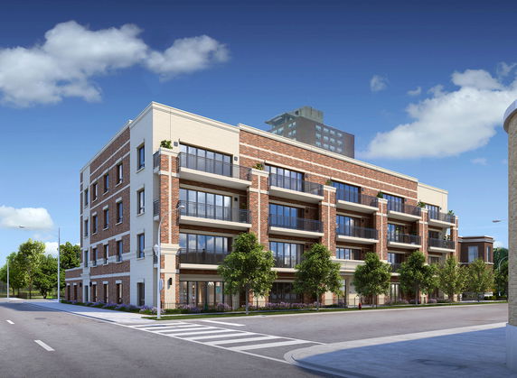 Front view of a multi-story apartment building with brick facade.