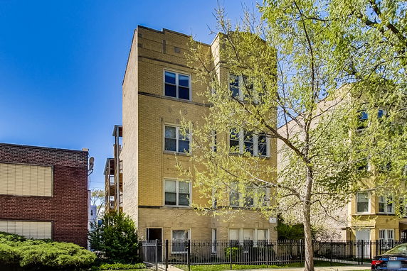 Front view of a multi-story brick building.