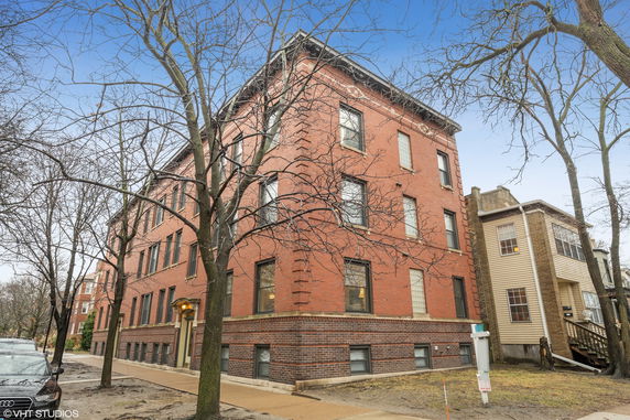 Front view of a multi-story brick building.