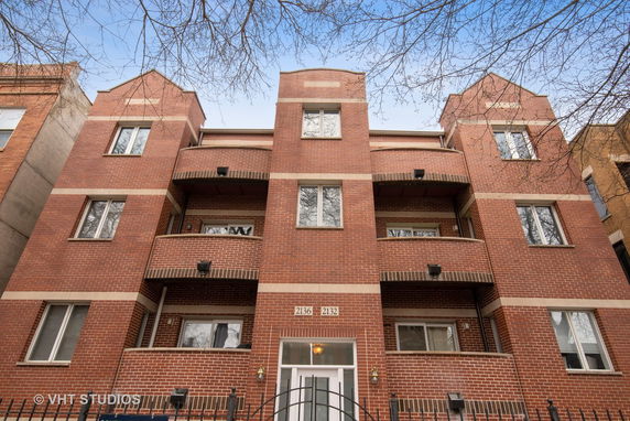 Front view of a multi-story brick residential building.