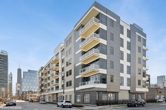 Front view of a multi-story modern apartment building.