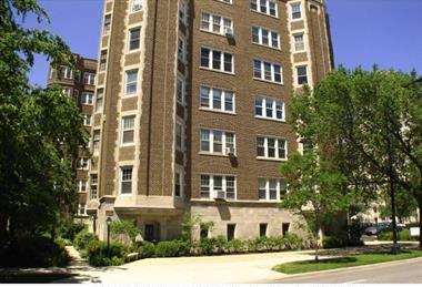 Front view of a multi-story brick building.