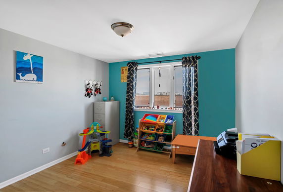 Indoor play area with toys and decorations in a small room.