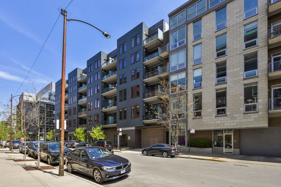 Front view of a modern multi-story apartment building.
