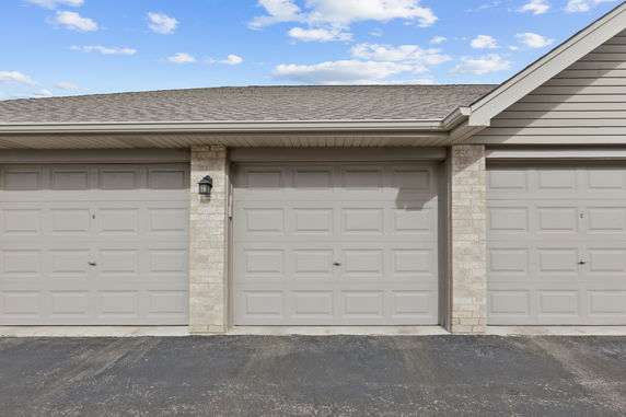 Front view of a building with multiple garage doors.