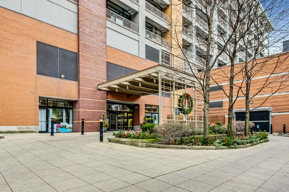 Front view of a multi-story building with a decorative entrance.