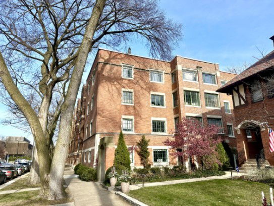 Front view of a four-story brick building.