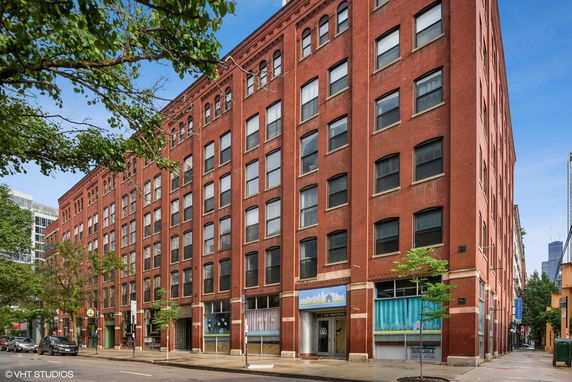 Front view of a multi-story brick building.