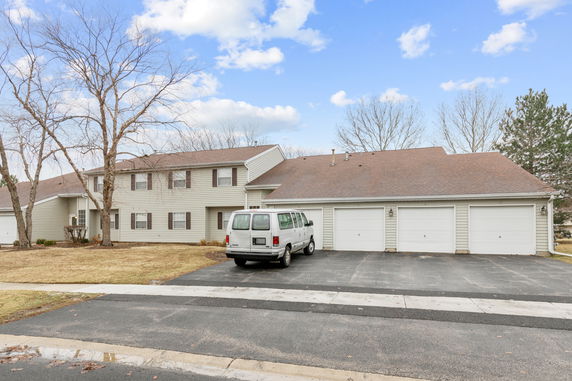 Front view of a two-story house with an attached garage.