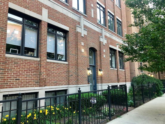 Front view of a multi-story brick building.