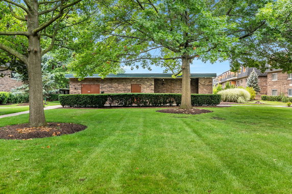 Front view of a low-rise brick building.