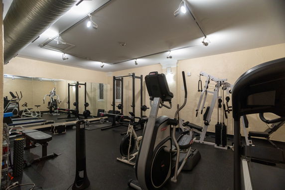 Indoor gym area with various exercise equipment