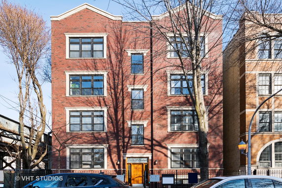 Front view of a brick multi-story apartment building