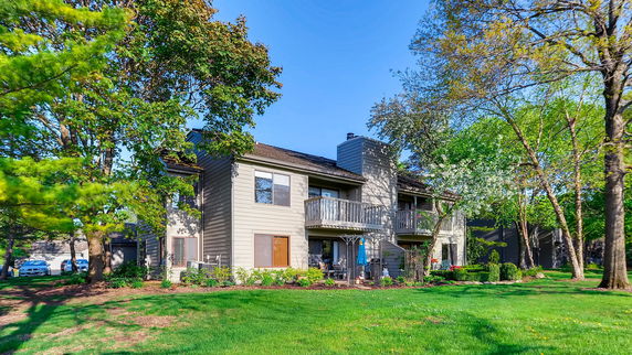 Front view of a two-story residential building with balconies.