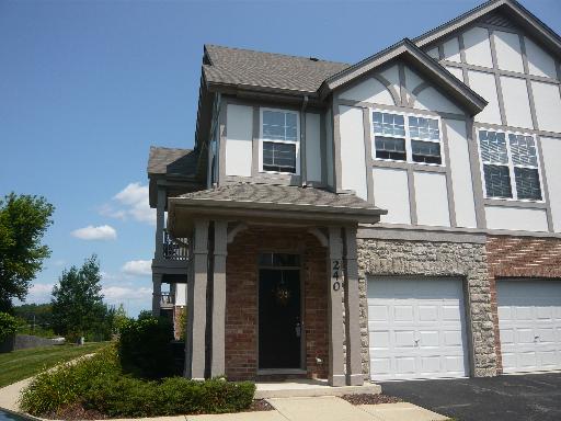 Front view of a two-story house with a double garage.