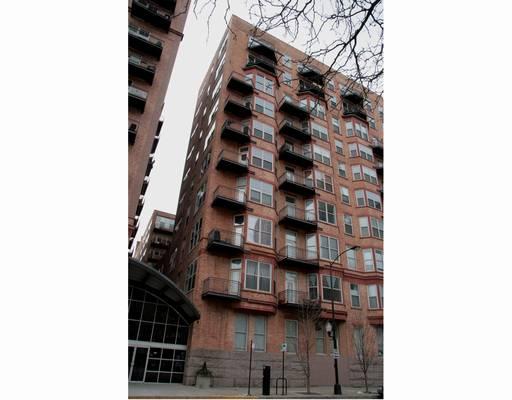 Front view of a multi-story brick apartment building.