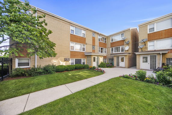 Front view of an apartment complex with multiple units.