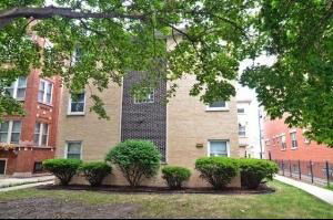 Front view of a multi-story brick building.