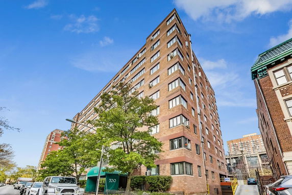 Front view of a multi-story residential building.