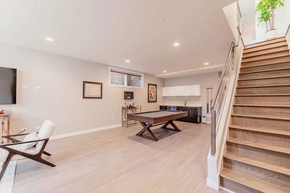 Indoor room with a pool table and seating area.