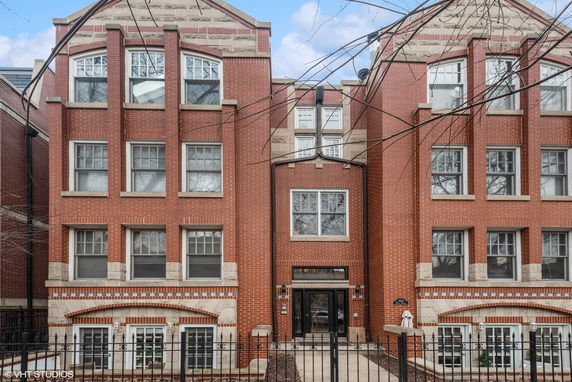 Front view of a multi-story brick building.