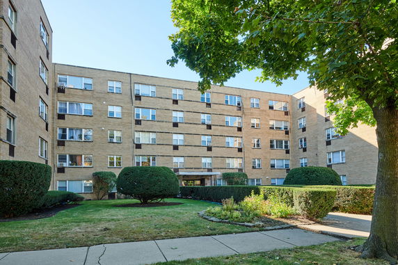 Front view of a multi-story apartment building.