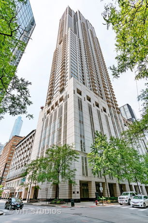 Front view of a tall modern high-rise building.