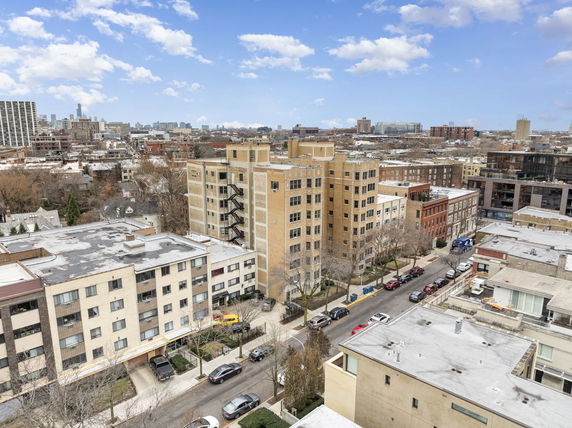 Panoramic view of a cityscape with multiple buildings and city skyline in the distance.