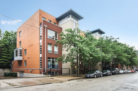 Front view of a multi-story building with modern design.