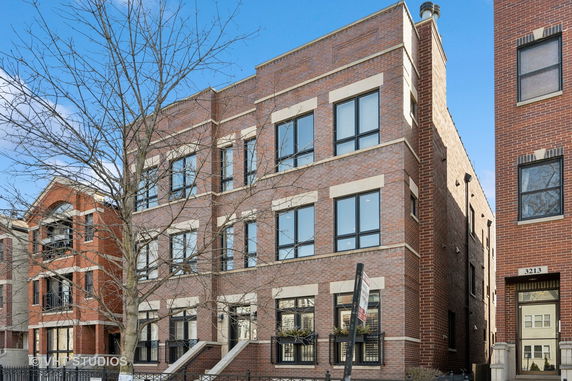 Front view of a multi-story brick building.