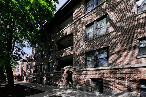 Front view of a brick multi-story residential building