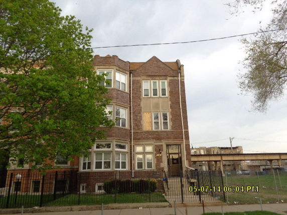 Front view of a multi-story brick building.
