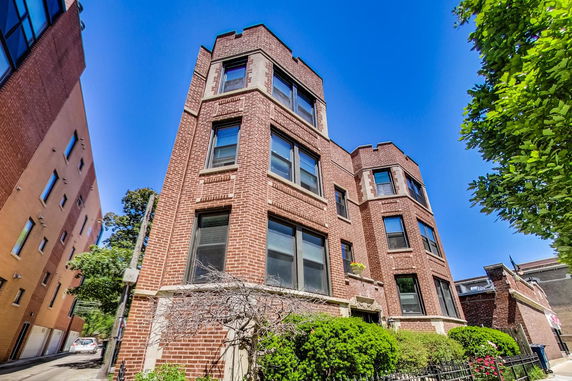 Front view of a multi-story brick building.